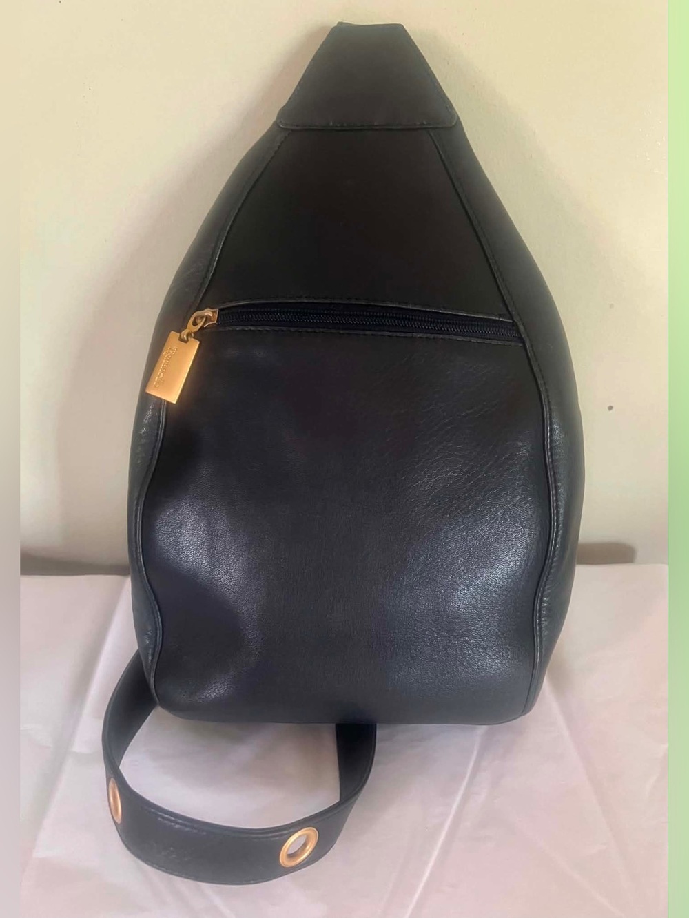Tignanello Black Leather Sling Backpack with Gold Accent